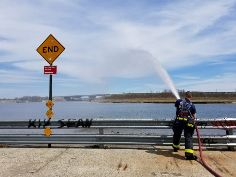member spraying hose in to water