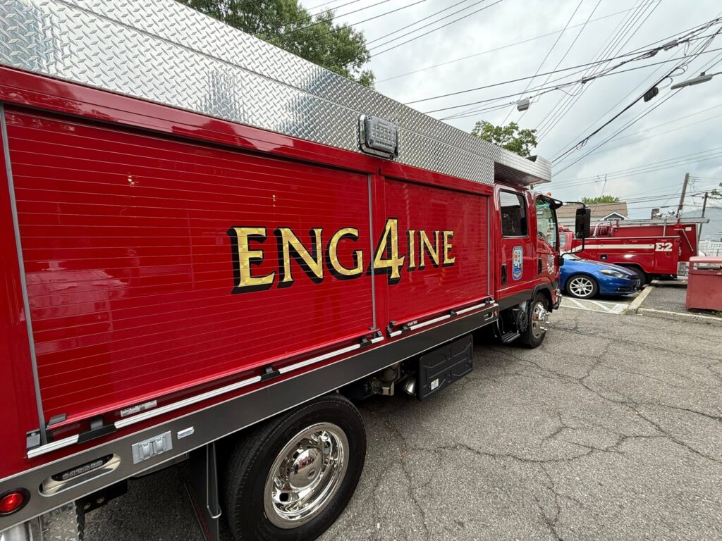 Side of red Edgewater Park Engine 4 with gold ENG4INE lettering.